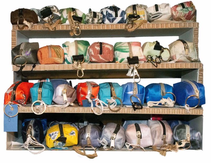 Image of a shelf full of mini utility keyring purses