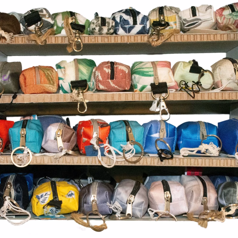 Image of a shelf full of mini utility keyring purses
