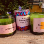 three champagne bottles turned into pot candles